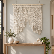 Entryway above a console, knotted leaf panel, twisted cord, pale wooden dowel