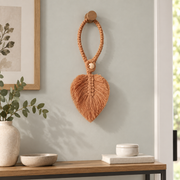 Hung on an entryway wall hook as an ornament, macrame leaf holdbacks in 6 colors