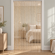 Iridescent multicolour strands held in a hand, shimmer string door curtain
