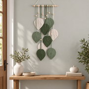Entryway above a bench, macrame leaf cascade on a dowel, twisted cord, combed flat at the leaves, pale wooden dowel