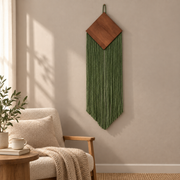 Minimal reading corner beside an armchair, wood diamond over a narrow chevron fringe