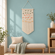 Autumn leaf macrame pennant above a bench on a soft blue nursery wall