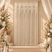 Macrame curtain used as a wedding backdrop with florals and pale drapery