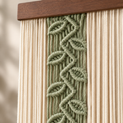 Macro of the green knotted leaf vine on cream cord, sage leaf vine panel