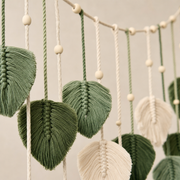 Close view of the cord and knotwork on the Woven Leaf Garland Wall Hanging, Green or Coffee