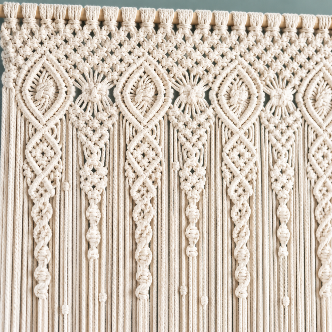Macro of the diamond and rosette knotwork releasing into cords