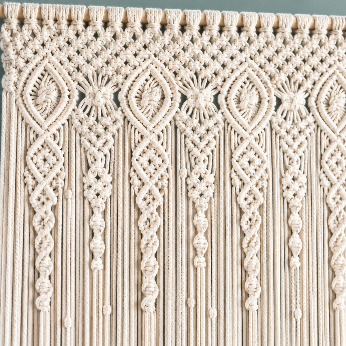 Macro of the diamond and rosette knotwork releasing into cords