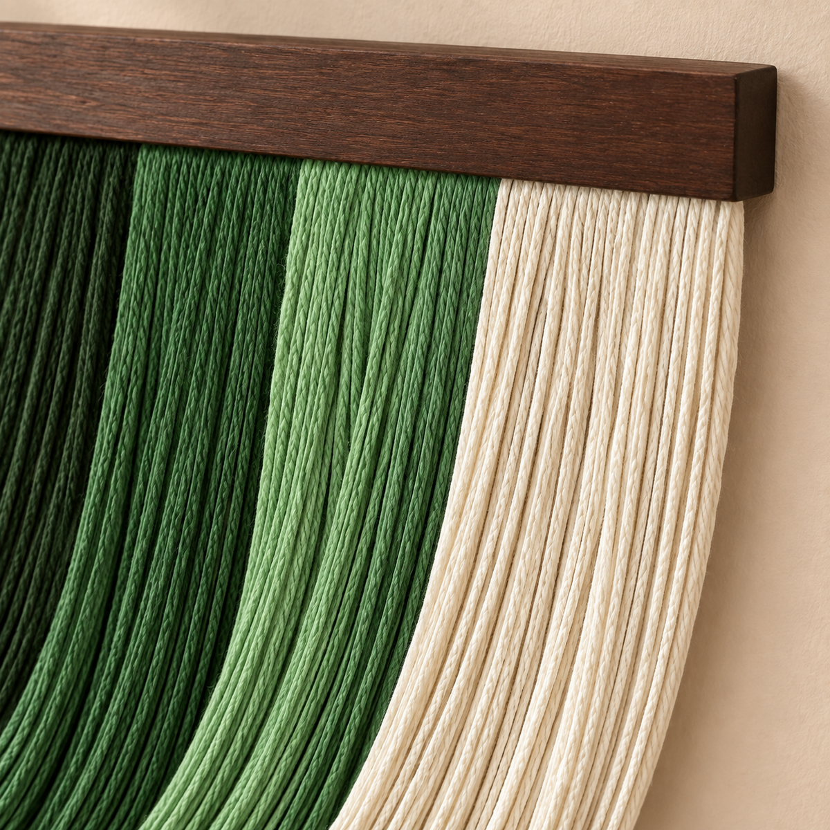 Close view of green and cream cord bands meeting the chunky dark batten