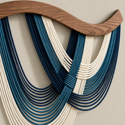 Macro of the blue loops and the cord binding at the crossing