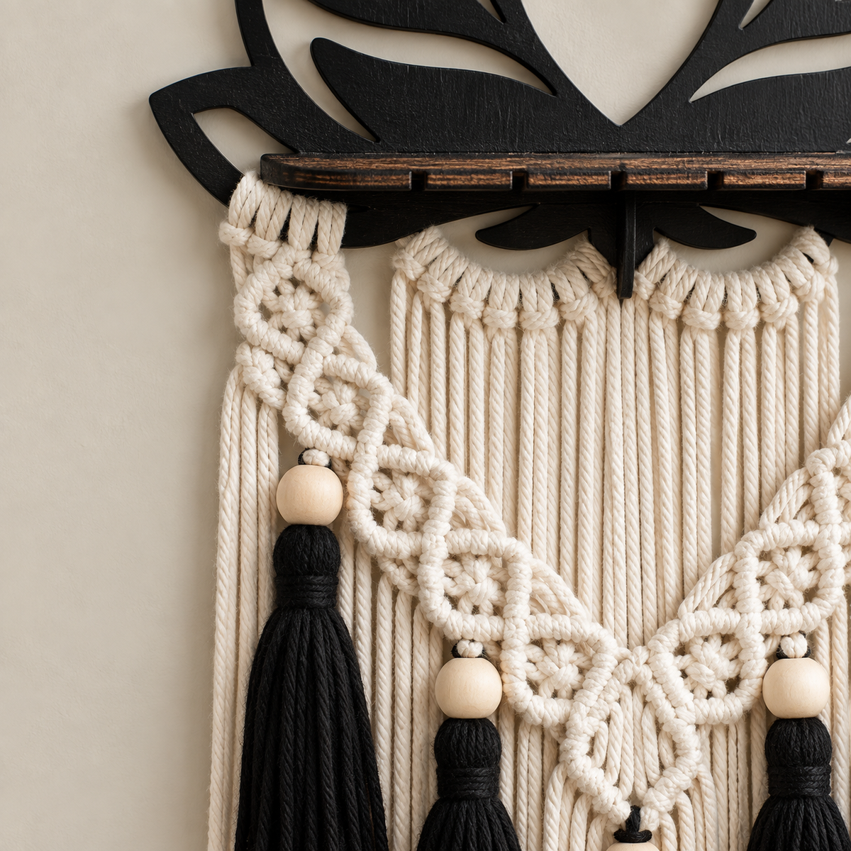 Close view of the black lotus edge, wooden ledge, beads and black tassels