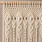 Close view of the pointed oval and diamond knot header on the wooden rod