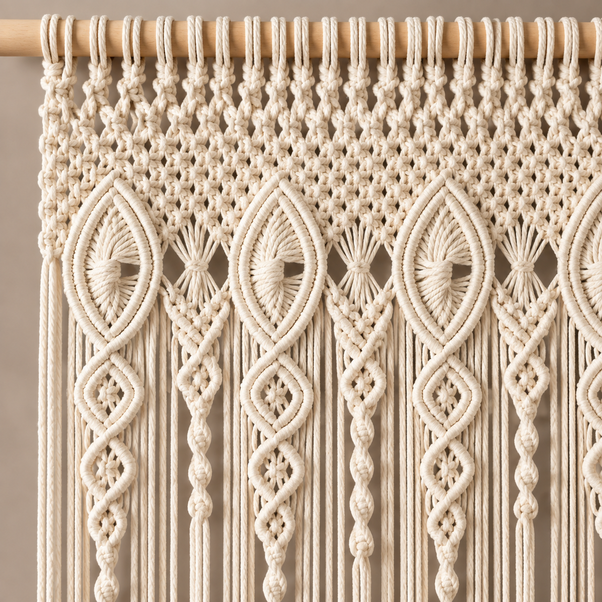 Close view of the pointed oval and diamond knot header on the wooden rod
