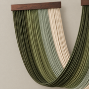 Macro of the green banding and the left batten, two battens crossing into one deep v