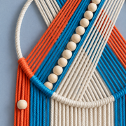 Macro of the ring, the chevron bands and the bead line, beaded hoop with chevron and fringe