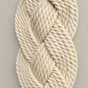 Macro of the plaited rope showing the twist of each ply, plaited rope column in cream