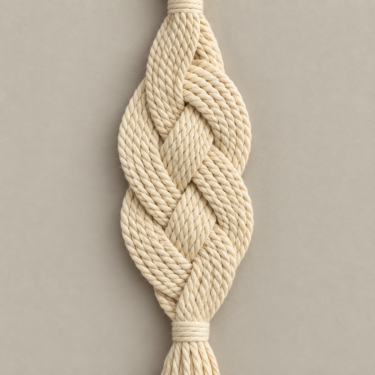 Macro of the braid and its two open bulges, braided rope wall pendant