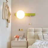 Modern bedroom with a wall-mounted light fixture, nightstand, and bed.