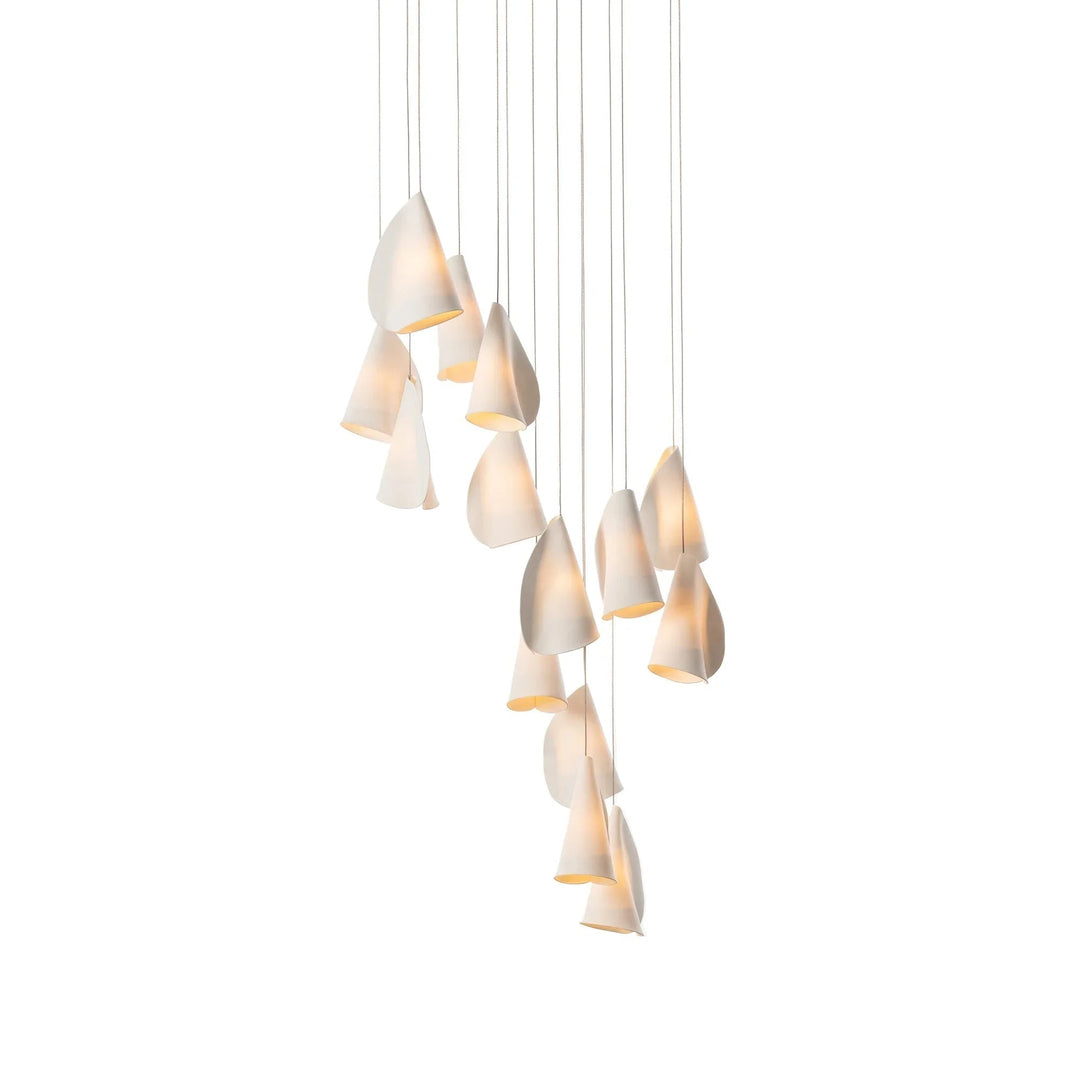 Chandelier with multiple glowing white porcelain shades arranged in a descending cluster against a white background.