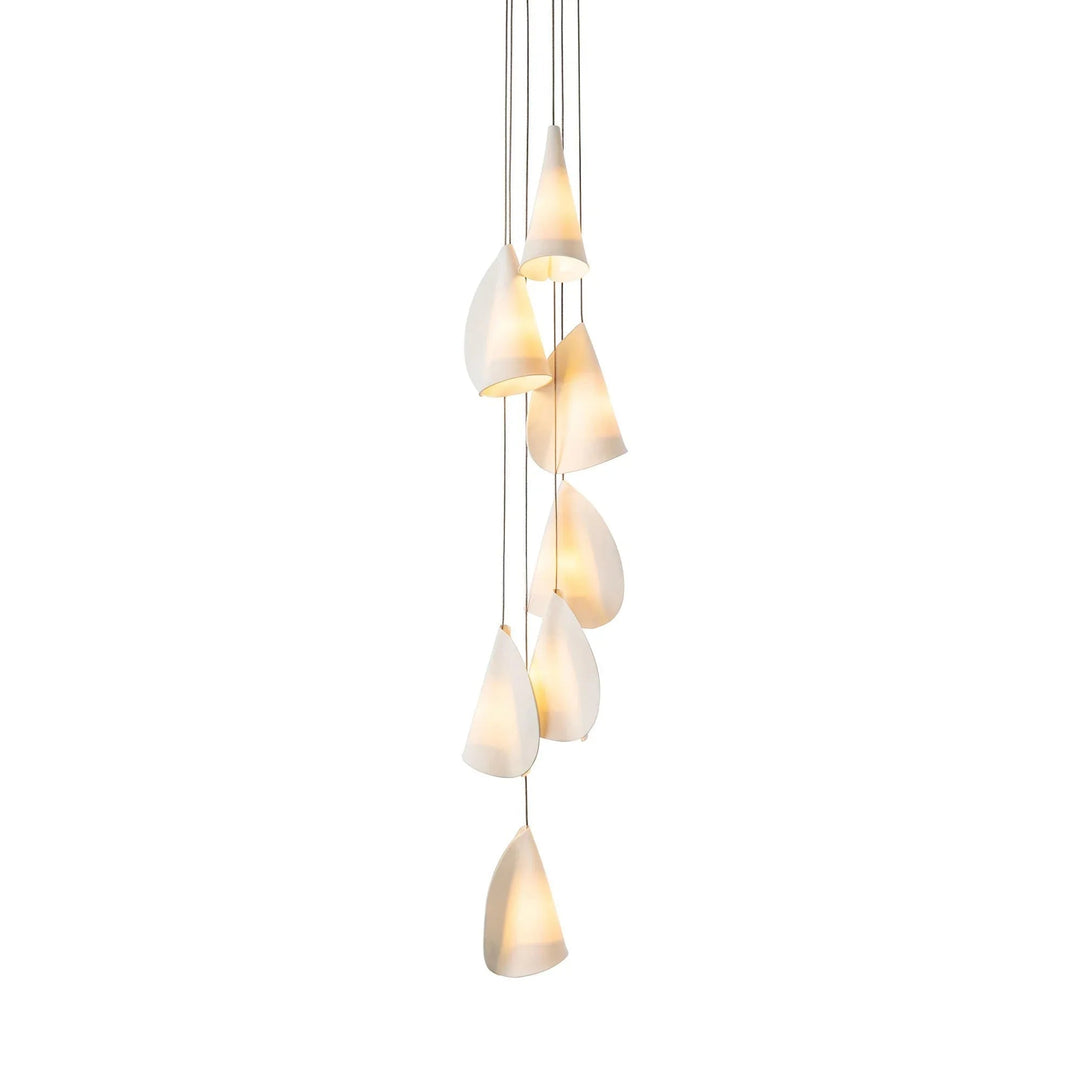 Chandelier with seven folded white porcelain shades cascading vertically on thin cords against a white background.