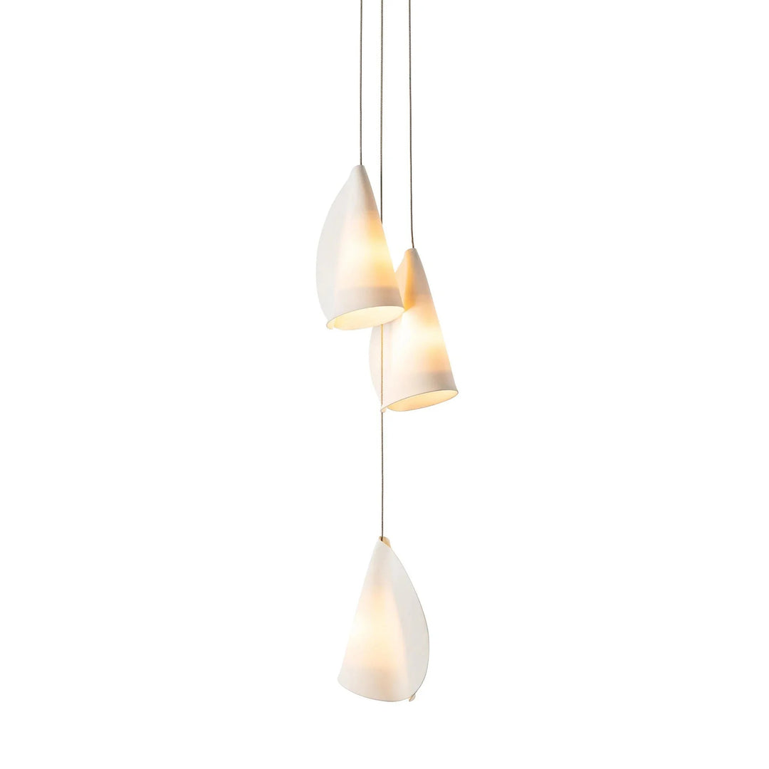 Chandelier with three glowing white porcelain shades suspended at staggered heights against a white background.