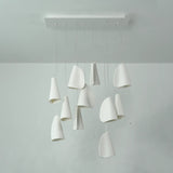 White porcelain chandelier with folded shades suspended at varied heights from a rectangular ceiling canopy, viewed from the front.