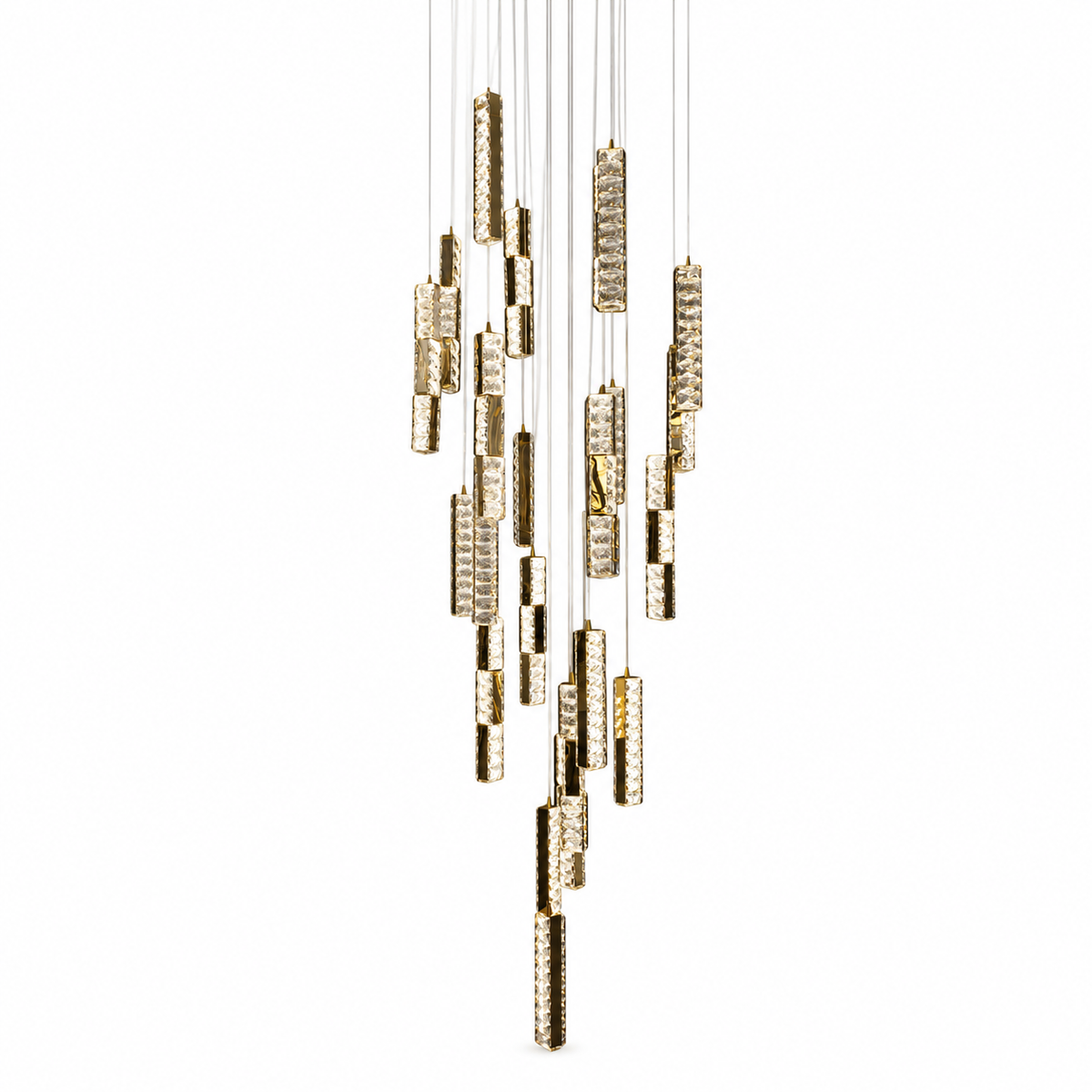 A modern multi-light linear chandelier with gold-finished cylindrical metal shades and clear glass panels, suspended from thin white cables against a solid white background.