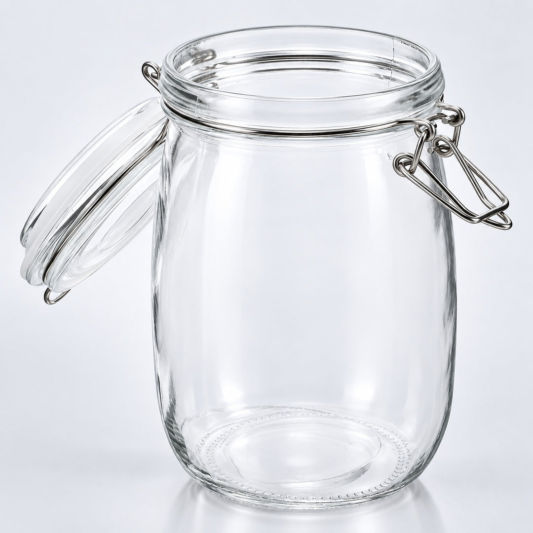 Clear glass jar with a swing-top clamp lid and detached glass lid, shown on a light gray studio background.