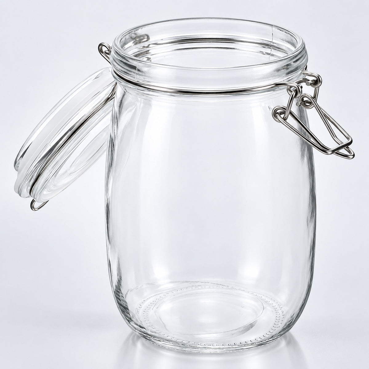 Clear glass jar with a swing-top clamp lid and detached glass lid, shown on a light gray studio background.