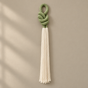 Studio, full piece on cream, rope knot with a cream tassel, thick three-strand twisted rope, fine combed cord tassel