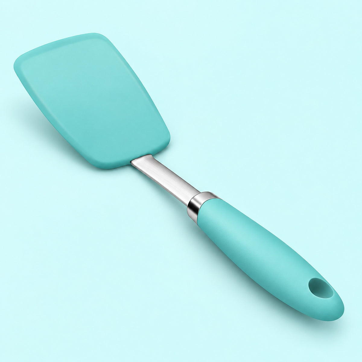 One lake-blue silicone turner spatula on a pale aqua studio background.