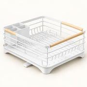 A white wire dish rack with light wood handles and a white plastic base, shown on a clean off-white background.