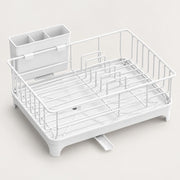 White plastic and wire dish drying rack with a built-in organizer cup, shown on a clean light beige background.