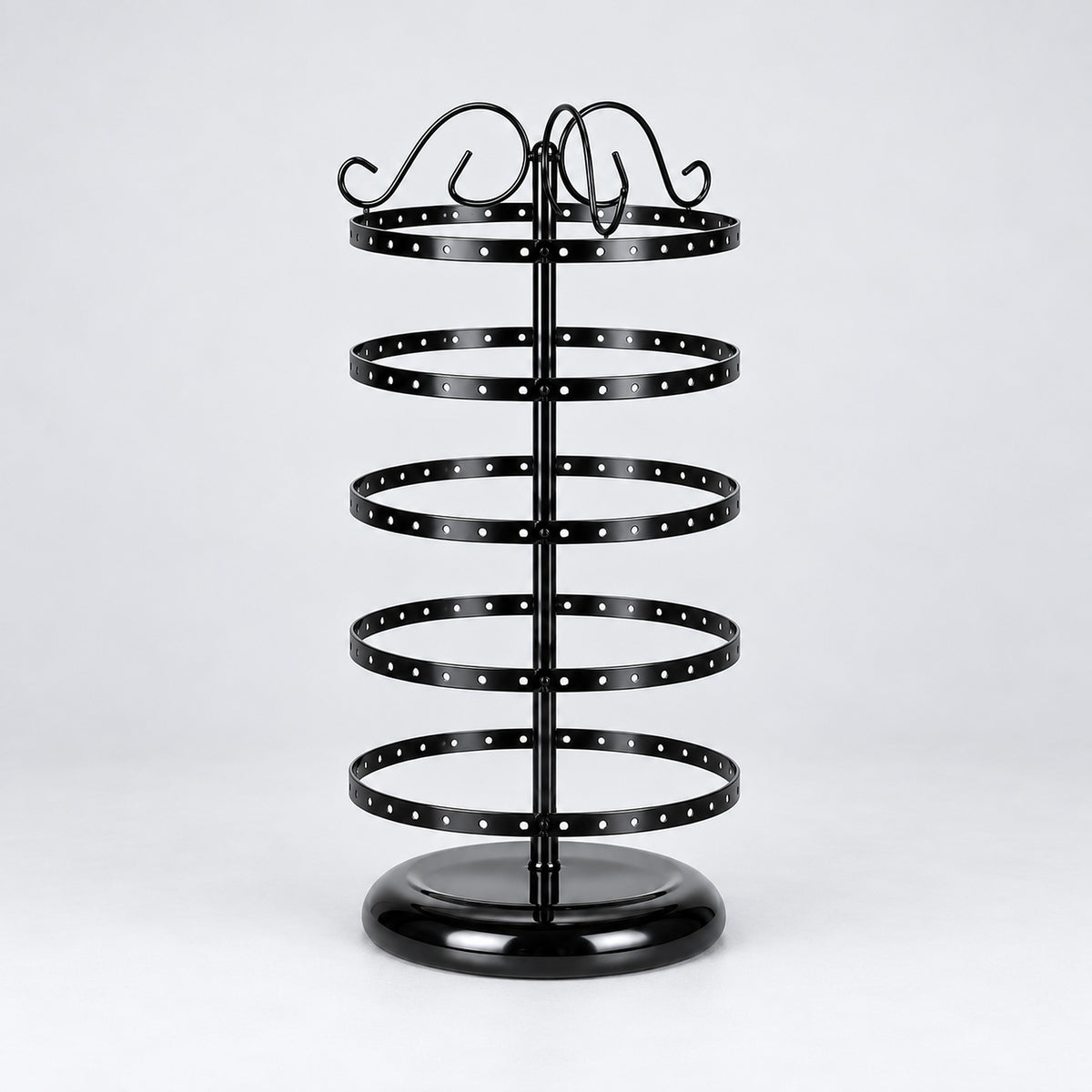 Empty black five-tier jewelry stand with domed circular black pedestal.