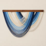 Blue studio on cream, graded swag fan in four colorways, fine twisted cord, stained wood rod