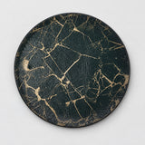 One Black and Gold artificial-leather coaster, 10 cm.
