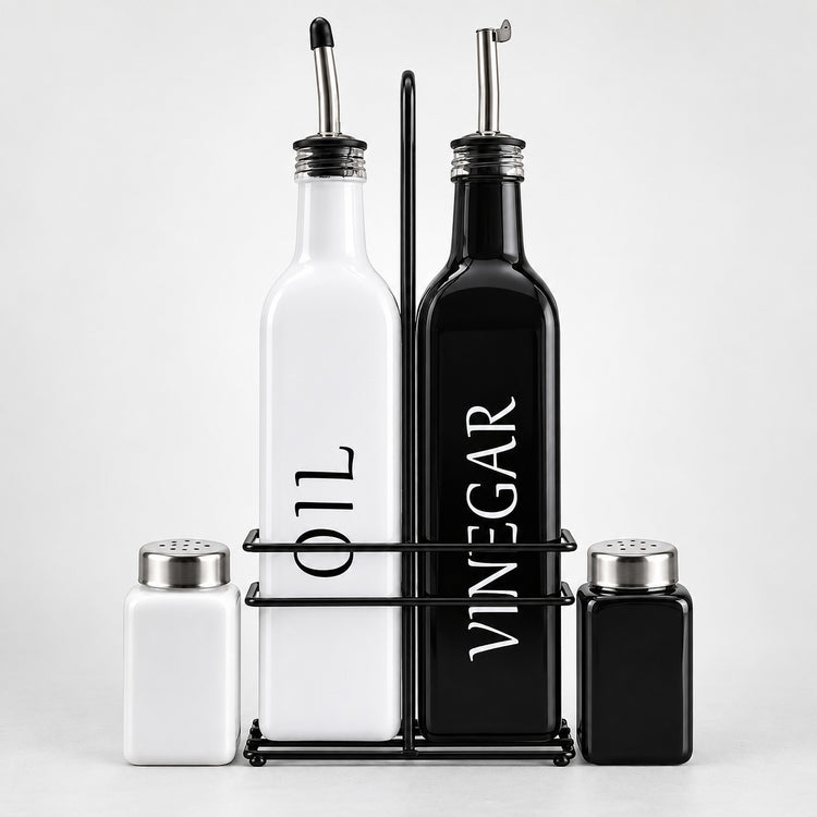 A set of kitchen bottles and shakers on a black metal stand against a light gray background. The set includes a tall white bottle labeled 'OIL', a tall black bottle labeled 'VINEGAR', a small white shaker, and a small black shaker with silver metal tops.