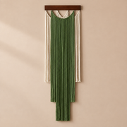 Deep green and cream layered fringe wall hanging with knotted scallops on warm
