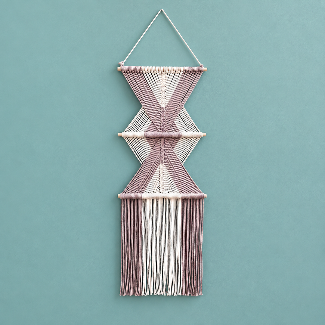 Pink studio on teal, stacked hourglass tiers, twisted cord, short pale dowels