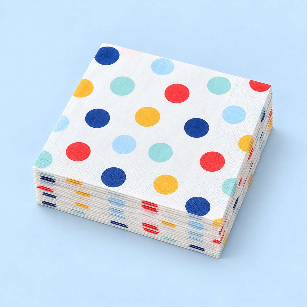 Stack of twenty matching folded large-dot paper napkins.