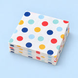 Stack of twenty matching folded large-dot paper napkins.