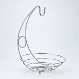Silver fruit basket with curved banana hanger, empty studio view.
