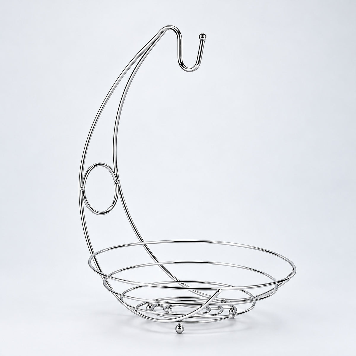 Silver fruit basket with curved banana hanger, empty studio view.