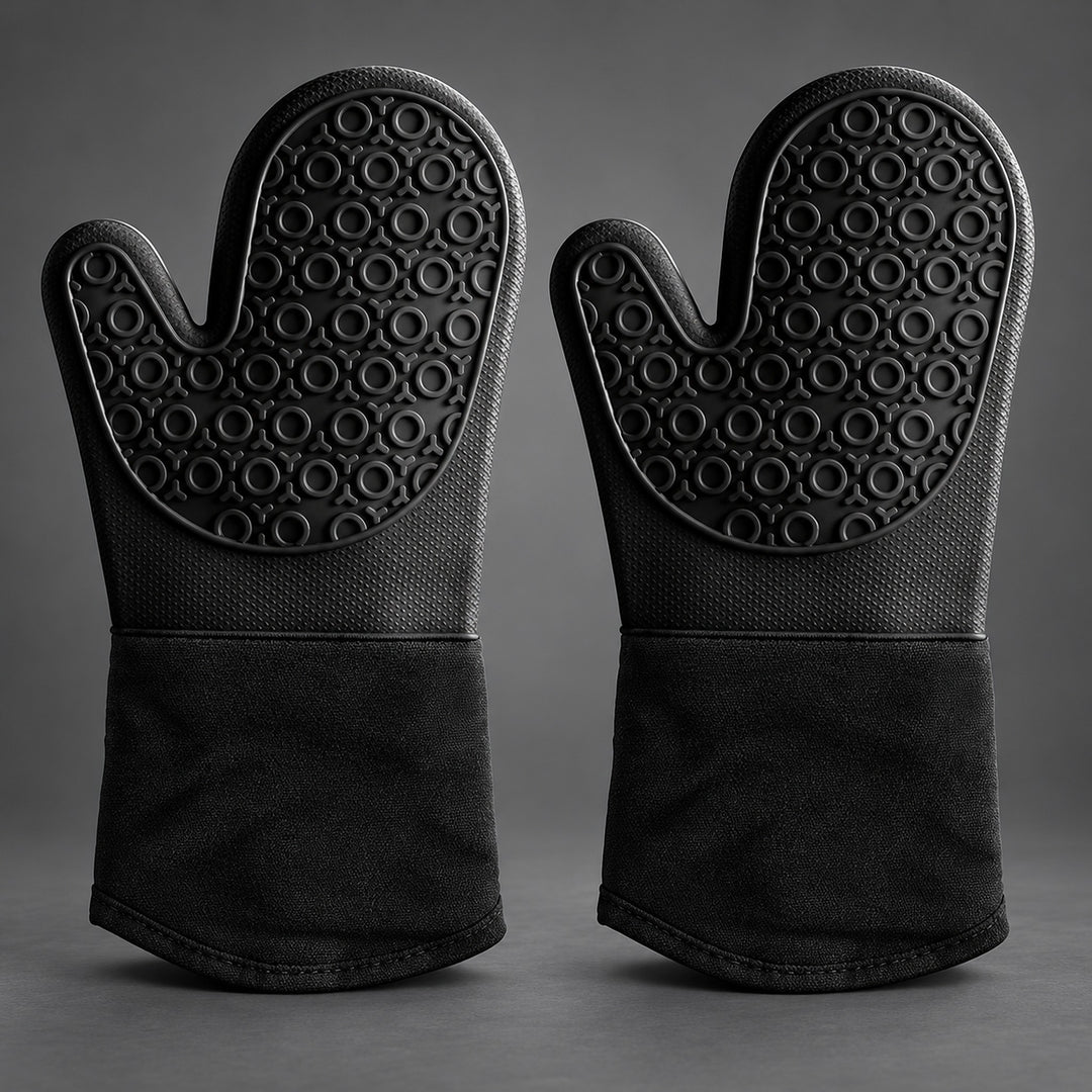 A pair of black silicone oven mitts with textured non-slip grips and a fabric cuff, displayed side-by-side on a dark gray background.
