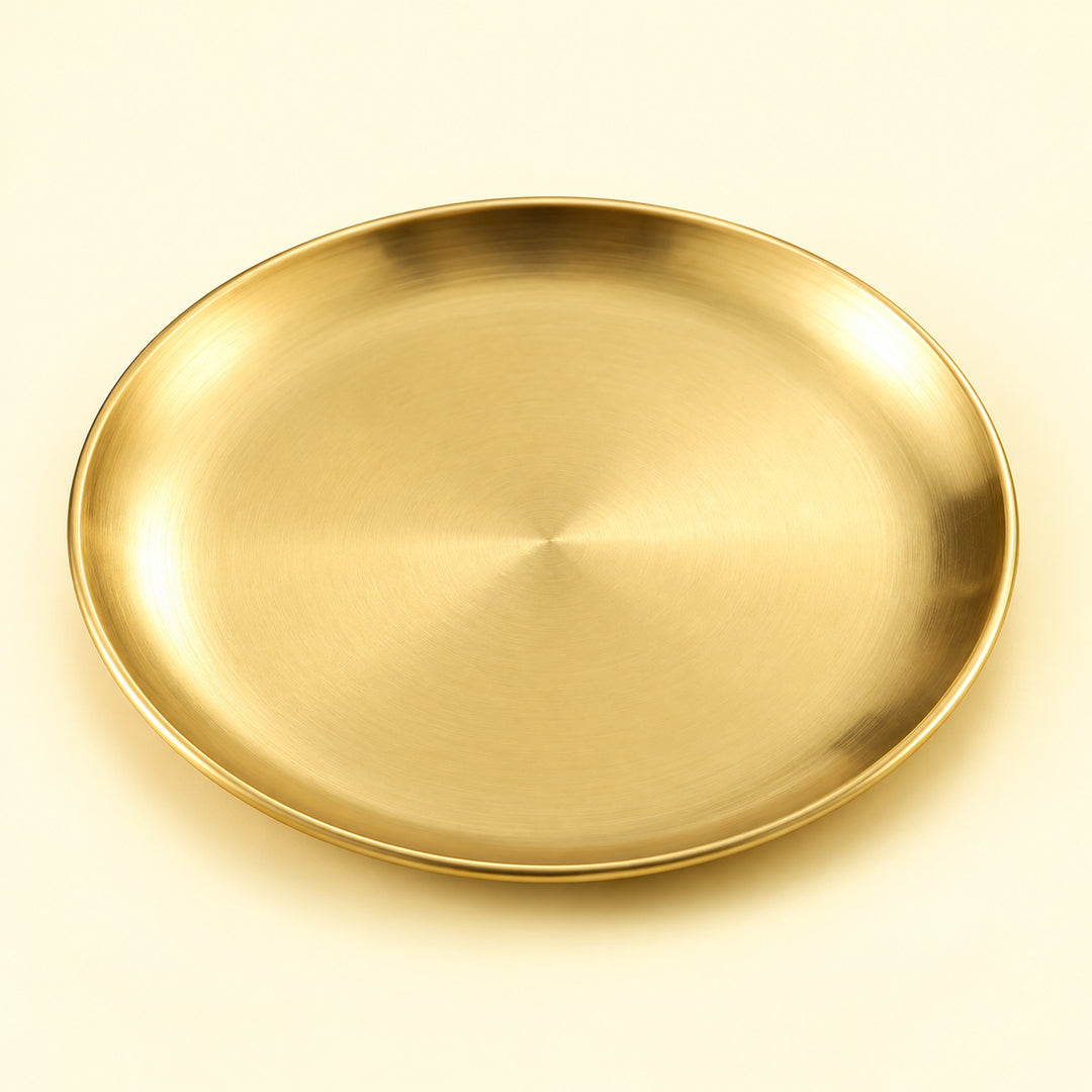 One gold round stainless steel serving plate, 14 cm diameter.