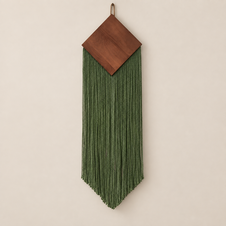 Green studio on cream, wood diamond over a narrow chevron fringe