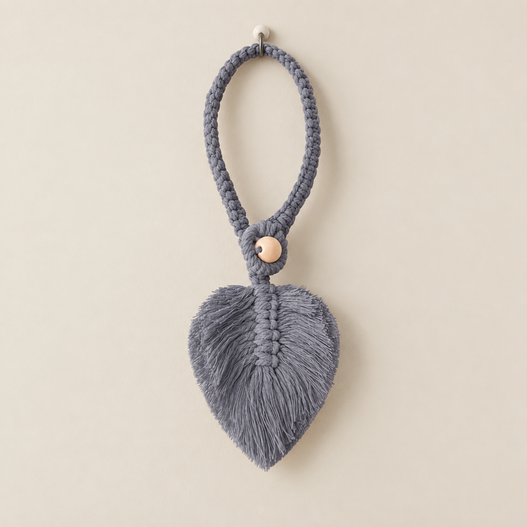 Gray studio on cream, macrame leaf holdbacks in 6 colors, twisted cord, combed flat at the leaf, round pale wooden bead