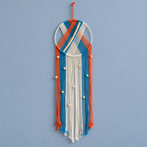 Orange and blue option studio on blue, beaded hoop with chevron and fringe