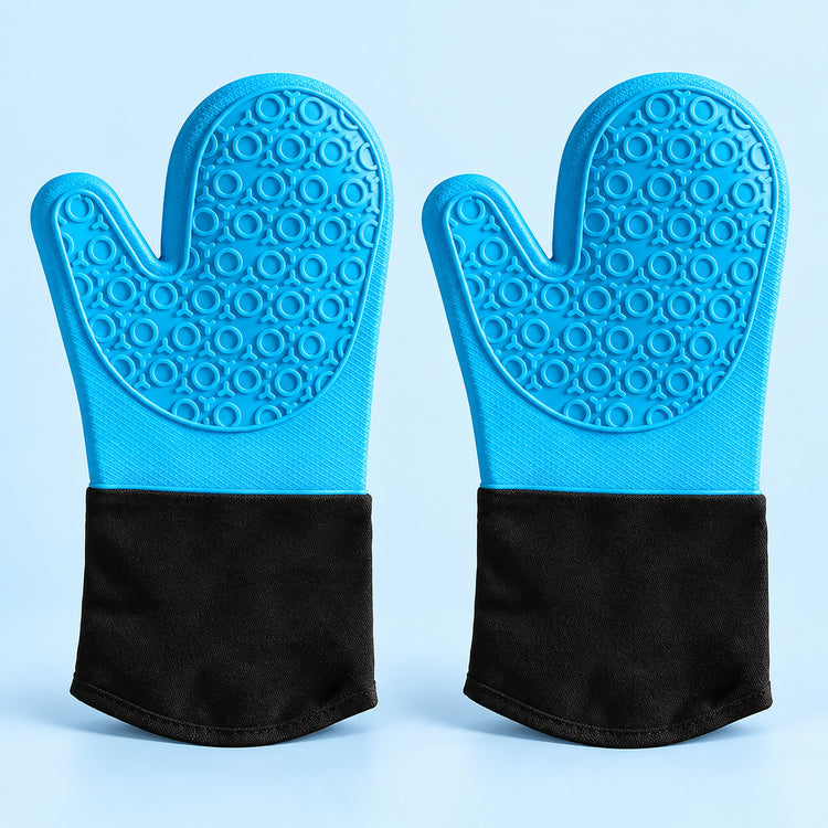 A pair of silicone oven mitts with textured blue backs and black fabric cuffs, displayed side-by-side on a light blue background.