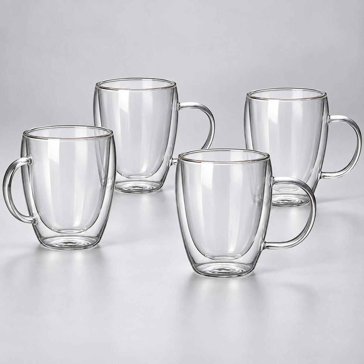 Four empty 350 ml clear double-wall glass mugs with handles.