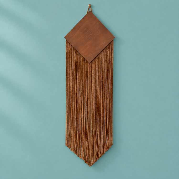 Brown studio on teal, wood diamond over a narrow chevron fringe